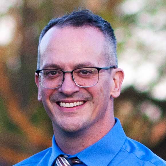headshot of Adam Buch